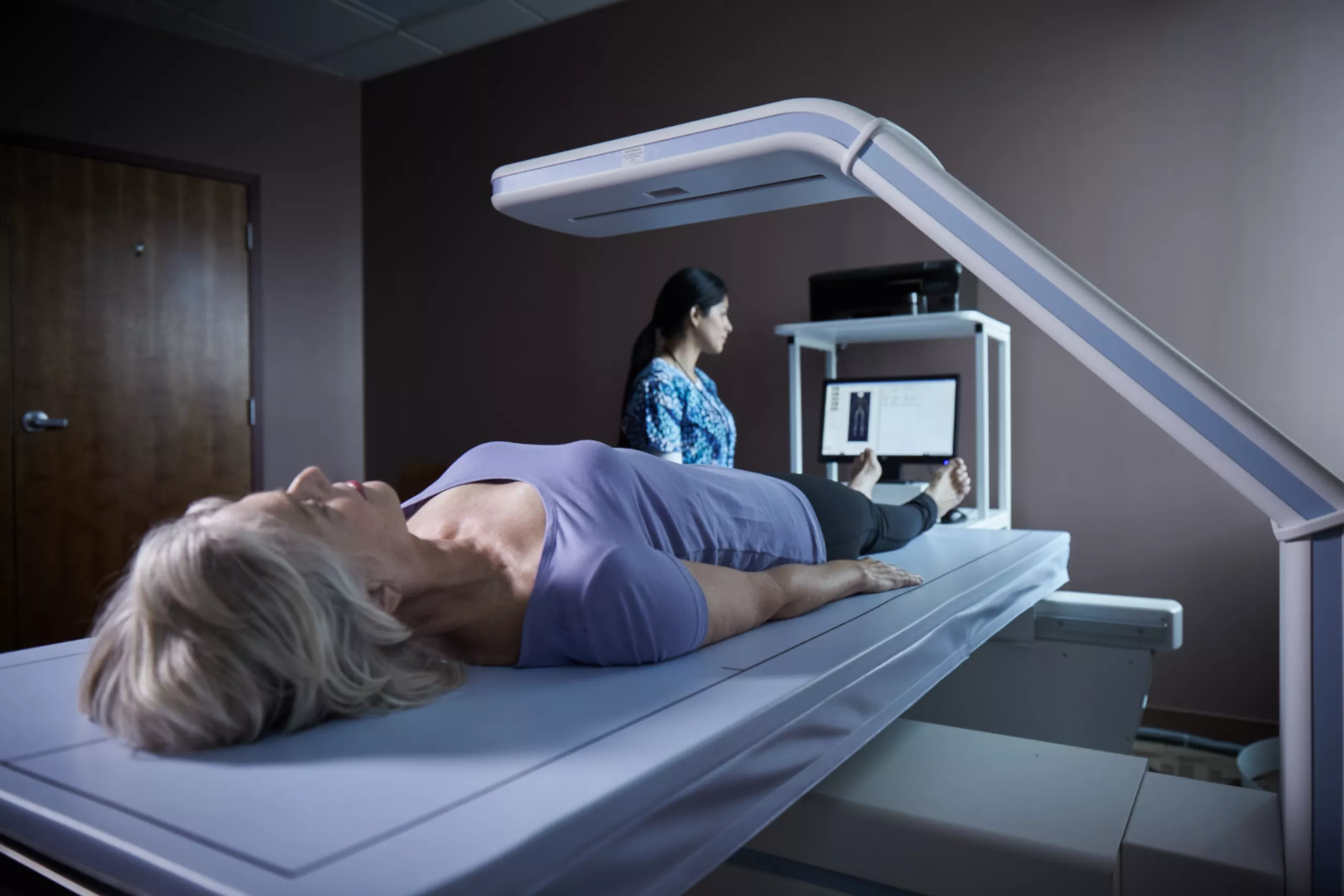 Patient lays on scanning table in lab setting